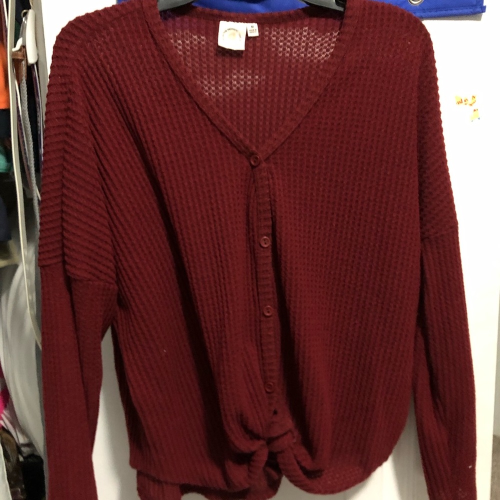 Burgundy sweater with tie at bottom